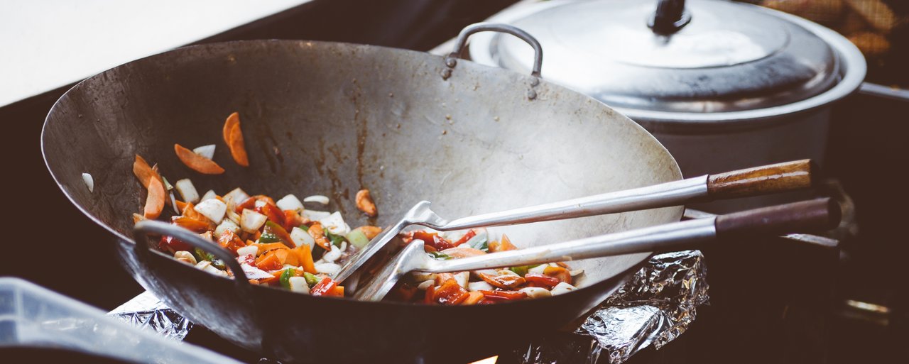Stir fry being cooked on a wok